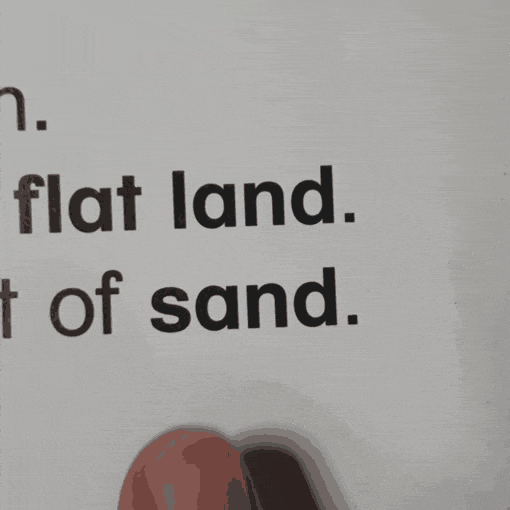 GIF shows the words flat, land, of sand.  A finger underneath the word sand points to s then a then n then d and then runs underneath the word. This is one way to help your child with home reading.  